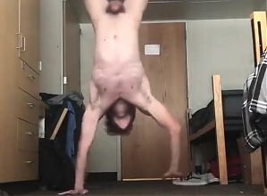 White blond twink stands on hands naked 
